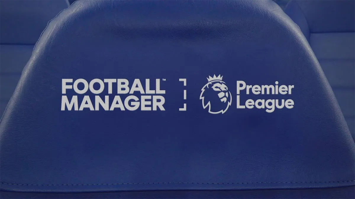 A seat in the dugout of a football stadium, with the Football Manager and Premier League logos etched onto it.