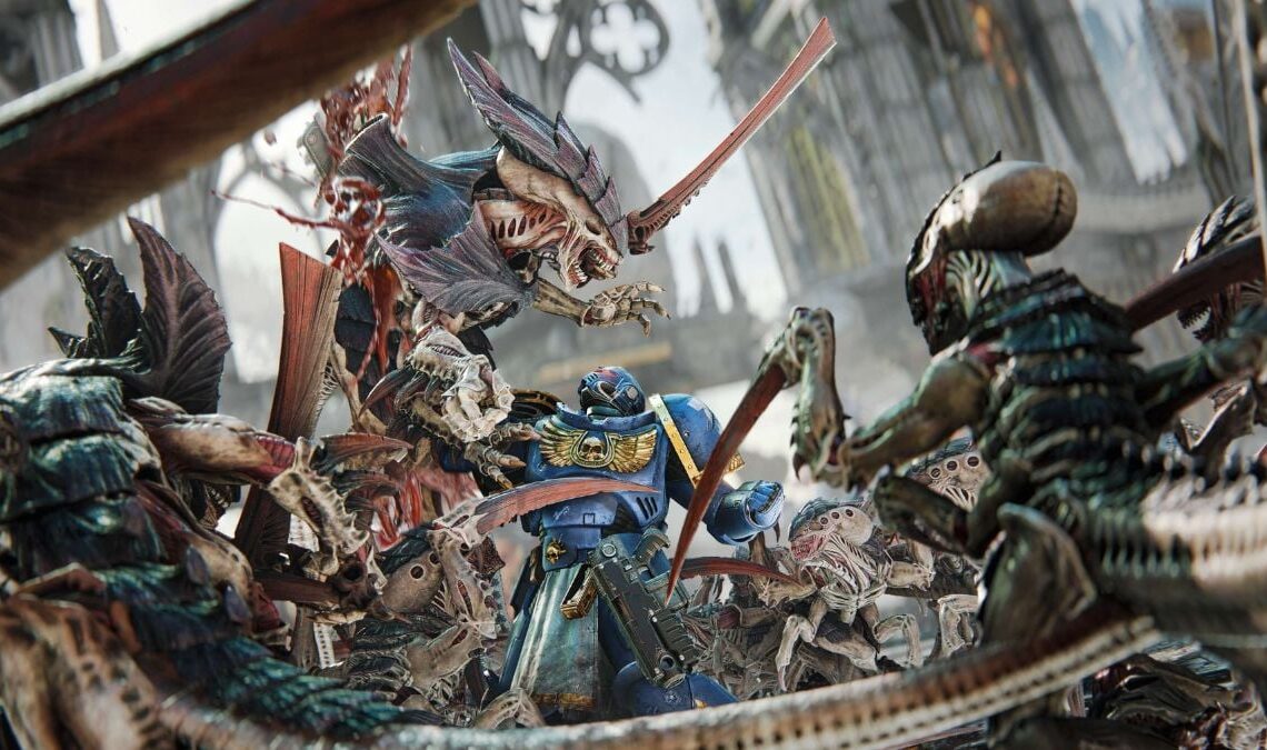 ultramarine killing tyranid in warhammer 40k space marine 2