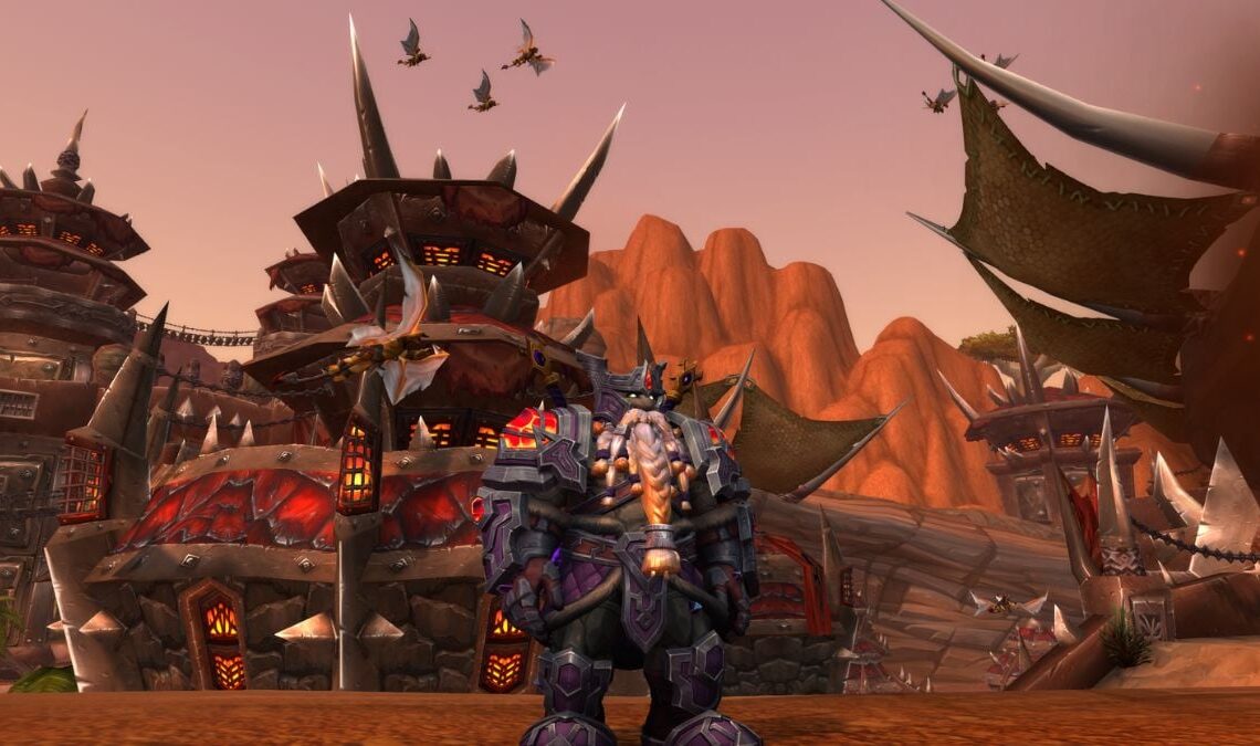 An Earthen dwarf stands in his heritage armor in front of Orgrimar