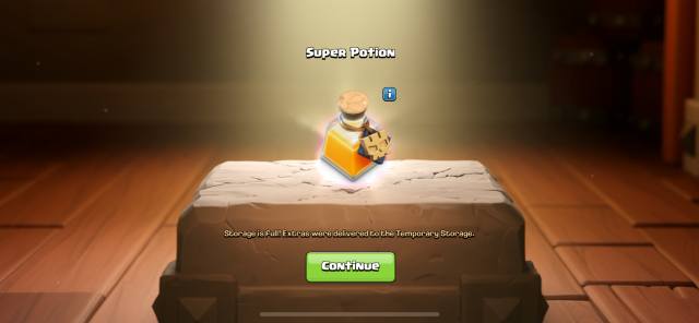 Une capture d'écran de l'obtention d'une super potion dans un coffre au trésor dans Clash of Clans.